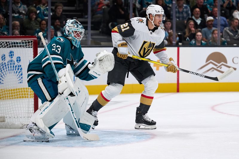 Oct 9, 2025; San Jose, California, USA; Vegas Golden Knights center Brett Howden (21) stands near the goal crease against San Jose Sharks goaltender Alex Nedeljkovic (33) during the first period at SAP Center at San Jose. Mandatory Credit: Robert Edwards-Imagn Images