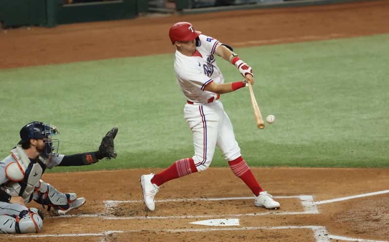 Jun 28, 2023; Arlington, Texas, USA;  Texas Rangers third baseman Josh Jung (6) hits an rbi single during the first inning against the Detroit Tigers at Globe Life Field. Mandatory Credit: Kevin Jairaj-USA TODAY Sports