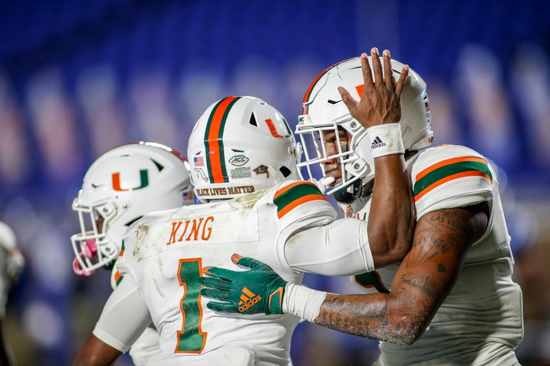 Dec 5, 2020; Durham, North Carolina, USA;  Miami Hurricanes quarterback D'Eriq King (1) celebrates with tight end Brevin Jordan (11) after they connected for a touchdown pass against the Duke Blue Devils in the first quarter at Wallace Wade Stadium. Mandatory Credit: Nell Redmond-USA TODAY Sports