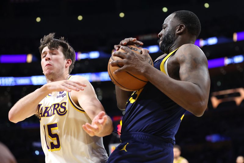 LOS ANGELES, CALIFORNIA - MARCH 16: Draymond Green #23 of the Golden State Warriors battles Austin Reaves #15 of the Los Angeles Lakers for a loose ball during the second half of a game at Crypto.com Arena on March 16, 2024 in Los Angeles, California. NOTE TO USER: User expressly acknowledges and agrees that, by downloading and or using this photograph, User is consenting to the terms and conditions of the Getty Images License Agreement. (Photo by Sean M. Haffey/Getty Images)