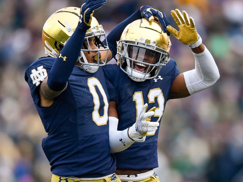 Oct 28, 2023; South Bend, Indiana, USA; Notre Dame Fighting Irish safety Xavier Watts (0) celebrates after an interception against the Pittsburgh Panthers in the second quarter at Notre Dame Stadium. Mandatory Credit: Matt Cashore-USA TODAY Sports