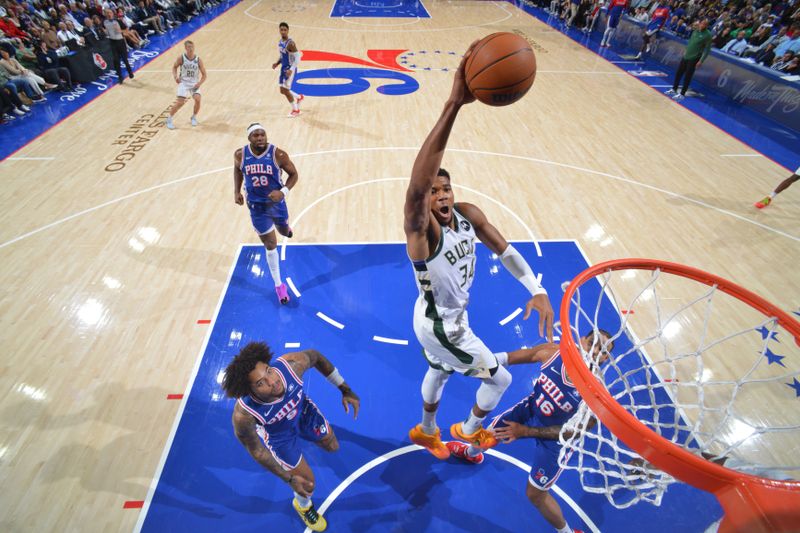 PHILADELPHIA, PA - OCTOBER 23: Giannis Antetokounmpo #34 of the Milwaukee Bucks dunks the ball during the game against the Philadelphia 76ers on October 23, 2024 at the Wells Fargo Center in Philadelphia, Pennsylvania NOTE TO USER: User expressly acknowledges and agrees that, by downloading and/or using this Photograph, user is consenting to the terms and conditions of the Getty Images License Agreement. Mandatory Copyright Notice: Copyright 2024 NBAE (Photo by Jesse D. Garrabrant/NBAE via Getty Images)