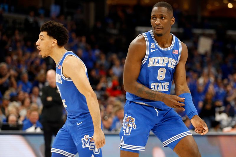 Mar 3, 2024; Memphis, Tennessee, USA; Memphis Tigers guard Jahvon Quinerly (11) and forward David Jones (8) react after a basket during the first half against the UAB Blazers at FedExForum. Mandatory Credit: Petre Thomas-USA TODAY Sports
