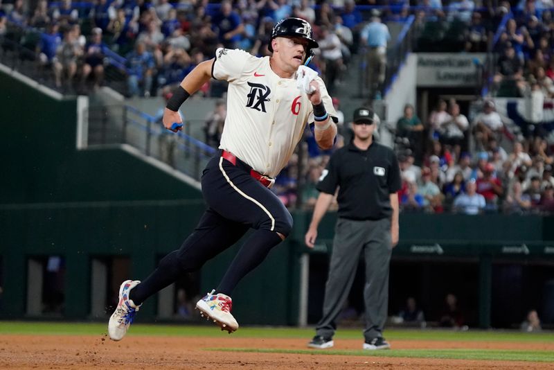 Aug 16, 2024; Arlington, Texas, USA; Texas Rangers third baseman Josh Jung (6) runs to third base during the sixth inning against the Minnesota Twins at Globe Life Field. Mandatory Credit: Raymond Carlin III-USA TODAY Sports
