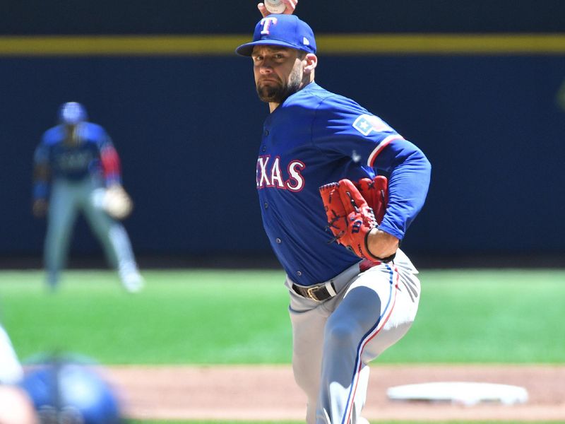 Jun 26, 2024; Milwaukee, Wisconsin, USA; Texas Rangers pitcher Nathan Eovaldi (17) delivers against the Milwaukee Brewers in the first inning at American Family Field. Mandatory Credit: Michael McLoone-USA TODAY Sports