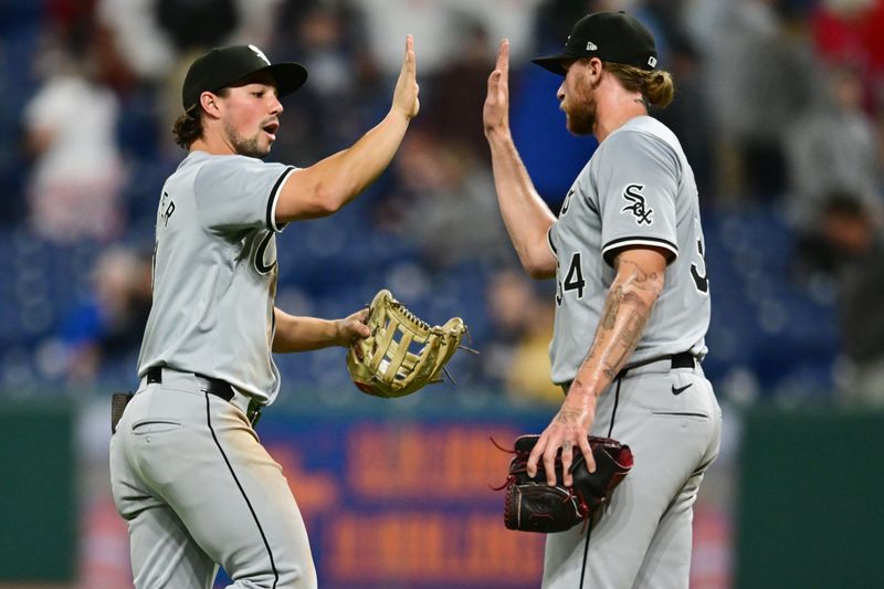 Apr 9, 2024; Cleveland, Ohio, USA; Chicago White Sox right fielder Dominic Fletcher (7) and pitcher Michael Kopech (34) celebrate after the White Sox beat the Cleveland Guardians at Progressive Field. Mandatory Credit: Ken Blaze-USA TODAY Sports