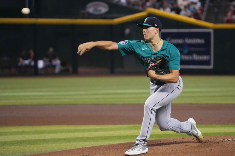 Jul 29, 2023; Phoenix, Arizona, USA; Seattle Mariners starting pitcher Bryan Woo (33) pitches against the Arizona Diamondbacks during the first inning at Chase Field. Mandatory Credit: Joe Camporeale-USA TODAY Sports