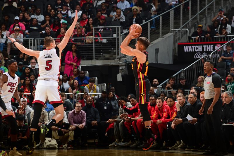 ATLANTA, GA - APRIL 9: Bogdan Bogdanovic #13 of the Atlanta Hawks shoots the ball during the game against the Miami Heat on April 9, 2024 at State Farm Arena in Atlanta, Georgia.  NOTE TO USER: User expressly acknowledges and agrees that, by downloading and/or using this Photograph, user is consenting to the terms and conditions of the Getty Images License Agreement. Mandatory Copyright Notice: Copyright 2024 NBAE (Photo by Scott Cunningham/NBAE via Getty Images)