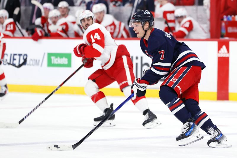 Dec 20, 2023; Winnipeg, Manitoba, CAN; Winnipeg Jets center Vladislav Namestnikov (7) skates up the ice past Detroit Red Wings center Robby Fabbri (14) in the first period at Canada Life Centre. Mandatory Credit: James Carey Lauder-USA TODAY Sports