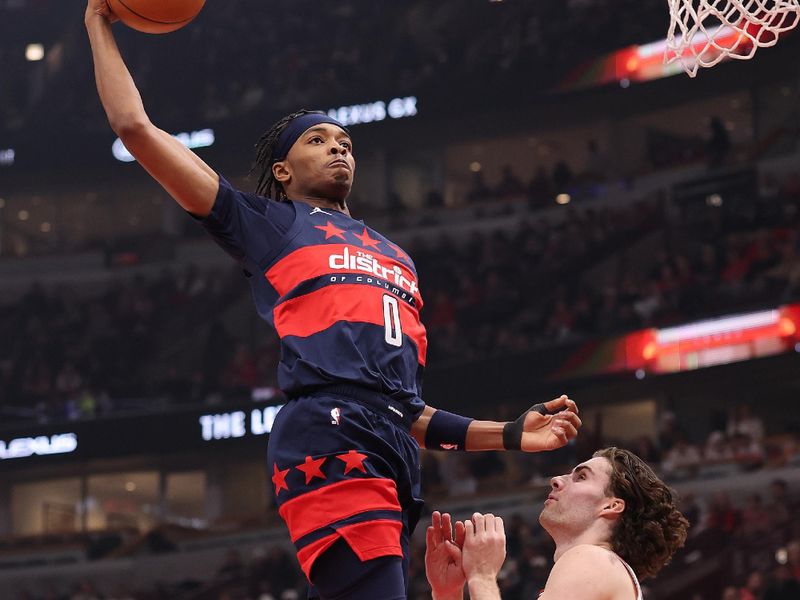 CHICAGO, ILLINOIS - JANUARY 10: Bilal Coulibaly #0 of the Washington Wizards goes up for a dunk over Josh Giddey #3 of the Chicago Bulls during the first half at the United Center on January 10, 2025 in Chicago, Illinois. NOTE TO USER: User expressly acknowledges and agrees that, by downloading and or using this photograph, User is consenting to the terms and conditions of the Getty Images License Agreement.  (Photo by Michael Reaves/Getty Images)