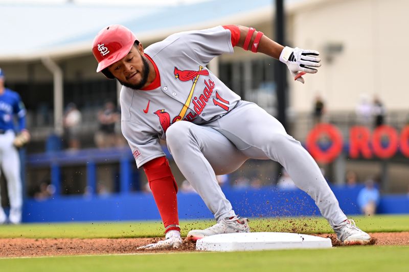 Feb 25, 2025; Dunedin, Florida, USA; St. Louis Cardinals left fielder Victor Scott II (11) reaches third base for a triple against the Toronto Blue Jays in the first inning of a spring training game at TD Ballpark. Mandatory Credit: Jonathan Dyer-Imagn Images