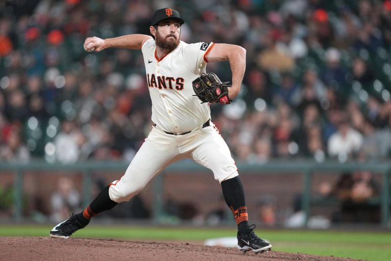 Apr 9, 2024; San Francisco, California, USA; San Francisco Giants pitcher Ryan Walker (74) throws a pitch against the Washington Nationals during the seventh inning at Oracle Park. Mandatory Credit: Darren Yamashita-USA TODAY Sports