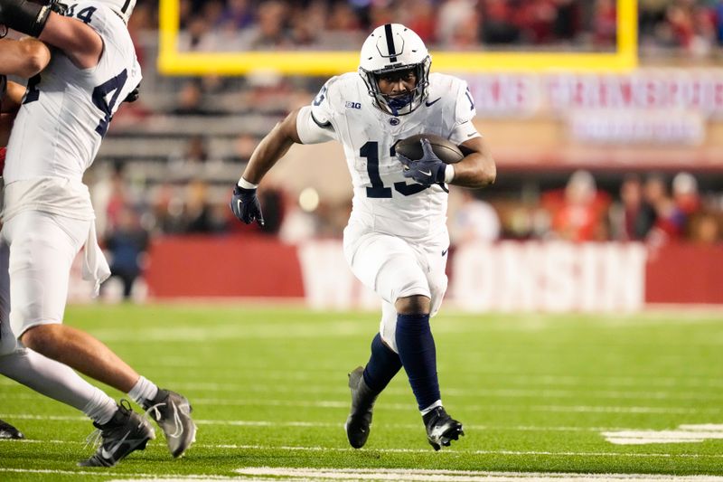 Oct 26, 2024; Madison, Wisconsin, USA;  Penn State Nittany Lions running back Kaytron Allen (13) rushes with the football before scoring a touchdown during the fourth quarter against the Wisconsin Badgers at Camp Randall Stadium. Mandatory Credit: Jeff Hanisch-Imagn Images