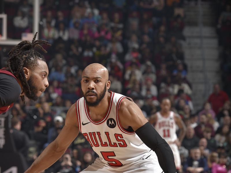 CLEVELAND, OH - FEBRUARY 14: Jevon Carter #5 of the Chicago Bulls plays defense during the game against the Cleveland Cavaliers on February 14, 2024 at Rocket Mortgage FieldHouse in Cleveland, Ohio. NOTE TO USER: User expressly acknowledges and agrees that, by downloading and/or using this Photograph, user is consenting to the terms and conditions of the Getty Images License Agreement. Mandatory Copyright Notice: Copyright 2024 NBAE (Photo by David Liam Kyle/NBAE via Getty Images)