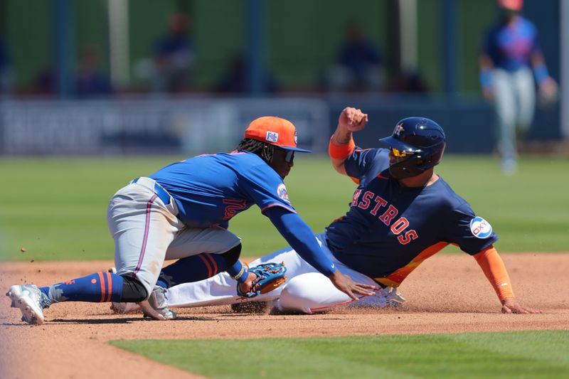 Mar 11, 2025; West Palm Beach, Florida, USA; New York Mets shortstop Luisangel Acuna (2) tags out Houston Astros third baseman Isaac Paredes (15) during the fourth inning at CACTI Park of the Palm Beaches. Mandatory Credit: Sam Navarro-Imagn Images