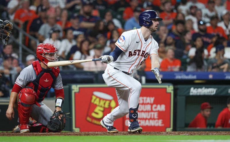 Aug 12, 2023; Houston, Texas, USA; Houston Astros right fielder Kyle Tucker (30) hits a single during the seventh inning against the Los Angeles Angels at Minute Maid Park. Mandatory Credit: Troy Taormina-USA TODAY Sports