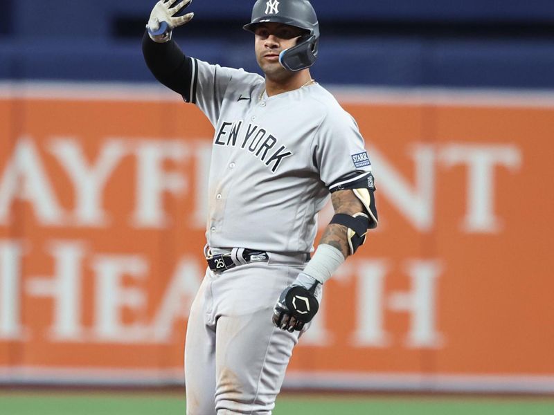 Aug 25, 2023; St. Petersburg, Florida, USA; New York Yankees second baseman Gleyber Torres (25) doubles during the seventh inning against the Tampa Bay Rays at Tropicana Field. Mandatory Credit: Kim Klement Neitzel-USA TODAY Sports