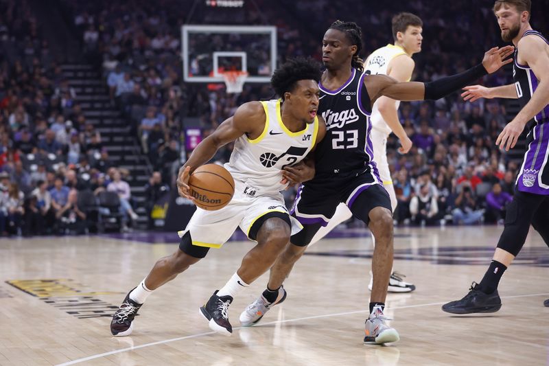 SACRAMENTO, CALIFORNIA - MARCH 31: Collin Sexton #2 of the Utah Jazz drives to the basket against Keon Ellis #23 of the Sacramento Kings in the first quarter at Golden 1 Center on March 31, 2024 in Sacramento, California. NOTE TO USER: User expressly acknowledges and agrees that, by downloading and or using this photograph, User is consenting to the terms and conditions of the Getty Images License Agreement. (Photo by Lachlan Cunningham/Getty Images)