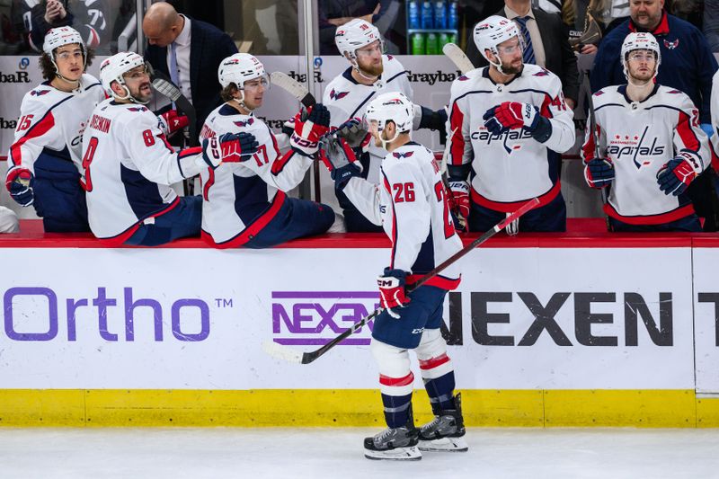 Dec 10, 2023; Chicago, Illinois, USA; Washington Capitals center Nic Dowd (26) celebrates his goal against the Chicago Blackhawks during the third period at the United Center. Mandatory Credit: Daniel Bartel-USA TODAY Sports