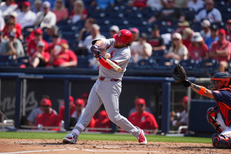 Mar 5, 2025; West Palm Beach, Florida, USA; St. Louis Cardinals outfielder Alec Burleson (41) hits a double against the Houston Astros during the third inning at CACTI Park of the Palm Beaches. Mandatory Credit: Rich Storry-Imagn Images