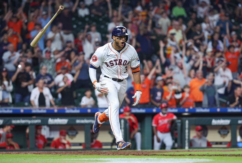 May 21, 2024; Houston, Texas, USA; Houston Astros shortstop Jeremy Pena (3) hits a walk-off RBI single during the tenth inning against the Los Angeles Angels at Minute Maid Park. Mandatory Credit: Troy Taormina-USA TODAY Sports