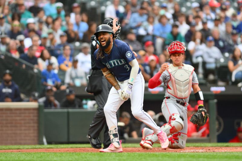 Jul 22, 2024; Seattle, Washington, USA; Seattle Mariners shortstop J.P. Crawford (3) reacts to being hit by a pitch during the first inning against the Los Angeles Angels at T-Mobile Park. Mandatory Credit: Steven Bisig-USA TODAY Sports