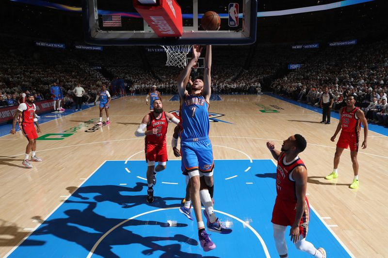 OKLAHOMA CITY, OK - APRIL 24: Chet Holmgren #7 of the Oklahoma City Thunder drives to the basket during the game against the New Orleans Pelicans during Round 1 Game 2 of the 2024 NBA Playoffs on April 24, 2024 at Paycom Arena in Oklahoma City, Oklahoma. NOTE TO USER: User expressly acknowledges and agrees that, by downloading and or using this photograph, User is consenting to the terms and conditions of the Getty Images License Agreement. Mandatory Copyright Notice: Copyright 2024 NBAE (Photo by Zach Beeker/NBAE via Getty Images)