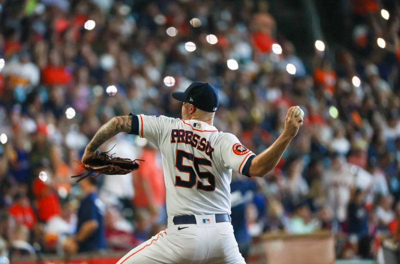 Aug 2, 2023; Houston, Texas, USA;  Houston Astros relief pitcher Ryan Pressly (55) warms up as fans hold their phone flashlights before pitching against the Cleveland Guardians in the ninth inning at Minute Maid Park. Mandatory Credit: Thomas Shea-USA TODAY Sports