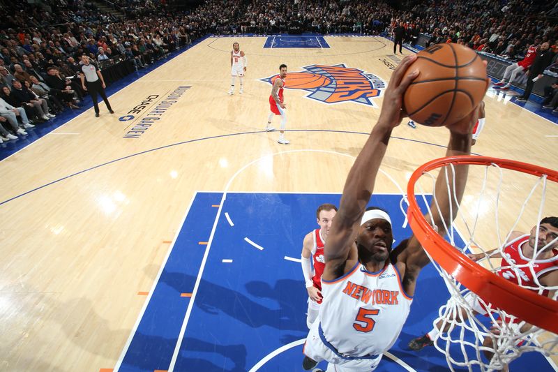 NEW YORK, NY - JANUARY 27: Precious Achiuwa #5 of the New York Knicks dunks the ball during the game against the Memphis Grizzlies on January 27, 2025 at Madison Square Garden in New York City, New York.  NOTE TO USER: User expressly acknowledges and agrees that, by downloading and or using this photograph, User is consenting to the terms and conditions of the Getty Images License Agreement. Mandatory Copyright Notice: Copyright 2025 NBAE  (Photo by Nathaniel S. Butler/NBAE via Getty Images)