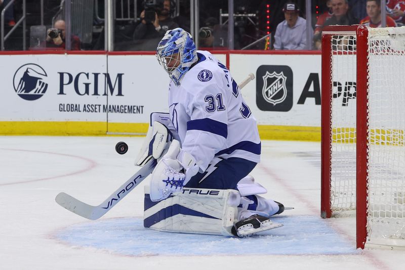 Oct 22, 2024; Newark, New Jersey, USA; Tampa Bay Lightning goaltender Jonas Johansson (31) makes a save against the Tampa Bay Lightning during the second period at Prudential Center. Mandatory Credit: Ed Mulholland-Imagn Images