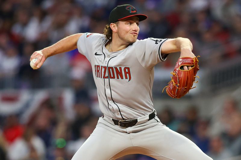 Apr 6, 2024; Atlanta, Georgia, USA; Arizona Diamondbacks starting pitcher Brandon Pfaadt (32) throws against the Atlanta Braves in the third inning at Truist Park. Mandatory Credit: Brett Davis-USA TODAY Sports