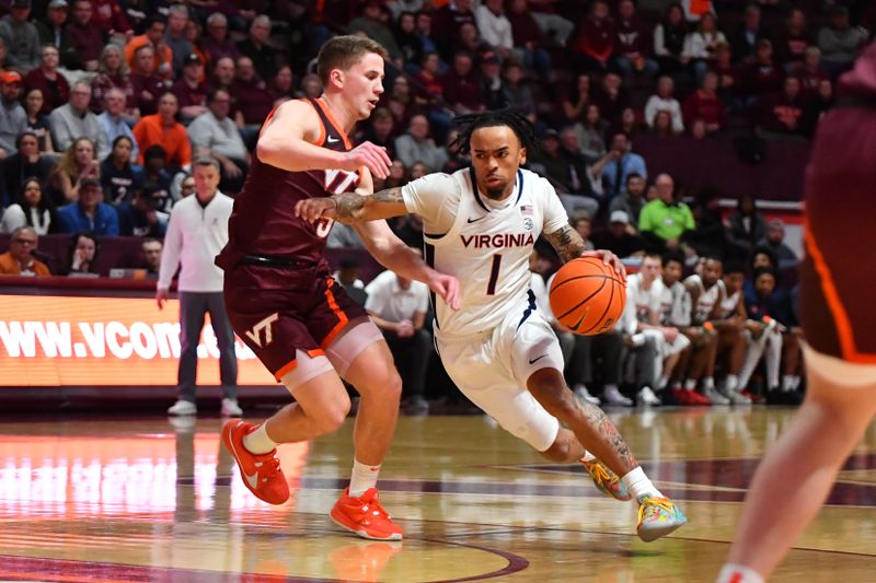 Feb 19, 2024; Blacksburg, Virginia, USA; Virginia Cavaliers guard Dante Harris (1) moves with the ball while being defended by Virginia Tech Hokies guard Sean Pedulla (3) during the first half at Cassell Coliseum. Mandatory Credit: Brian Bishop-USA TODAY Sports