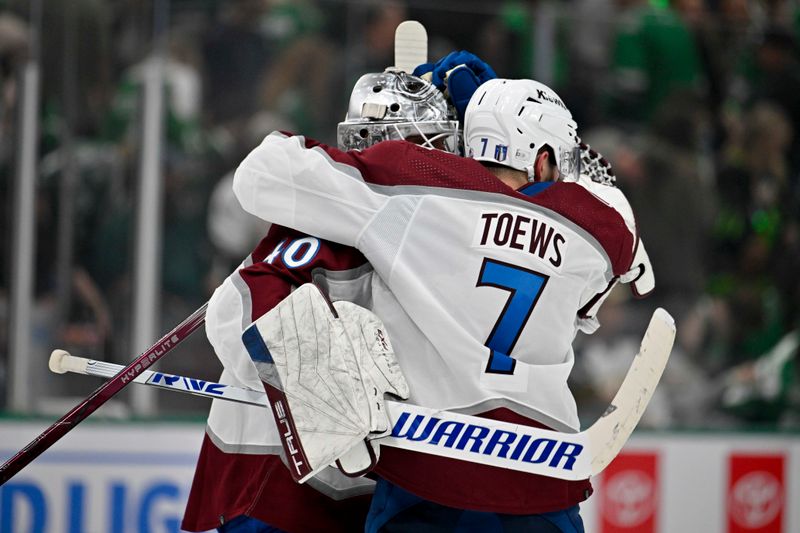 May 7, 2024; Dallas, Texas, USA; Colorado Avalanche goaltender Alexandar Georgiev (40) and defenseman Devon Toews (7) celebrate the win over the Dallas Stars in the overtime period in game one of the second round of the 2024 Stanley Cup Playoffs at American Airlines Center. Mandatory Credit: Jerome Miron-USA TODAY Sports