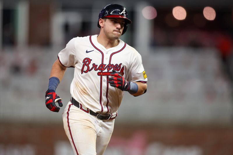 Aug 7, 2024; Atlanta, Georgia, USA; Atlanta Braves third baseman Austin Riley (27) hits a two-run home run against the Milwaukee Brewers in the fifth inning at Truist Park. Mandatory Credit: Brett Davis-USA TODAY Sports