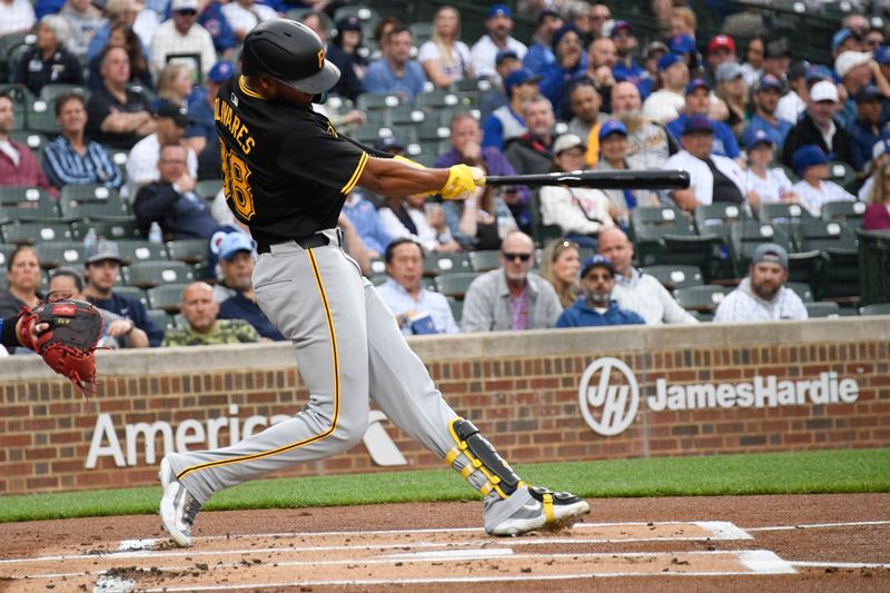 May 16, 2024; Chicago, Illinois, USA;  Pittsburgh Pirates outfielder Edward Olivares (38) hits a two run home run against the Chicago Cubs during the first inning at Wrigley Field. Mandatory Credit: Matt Marton-USA TODAY Sports