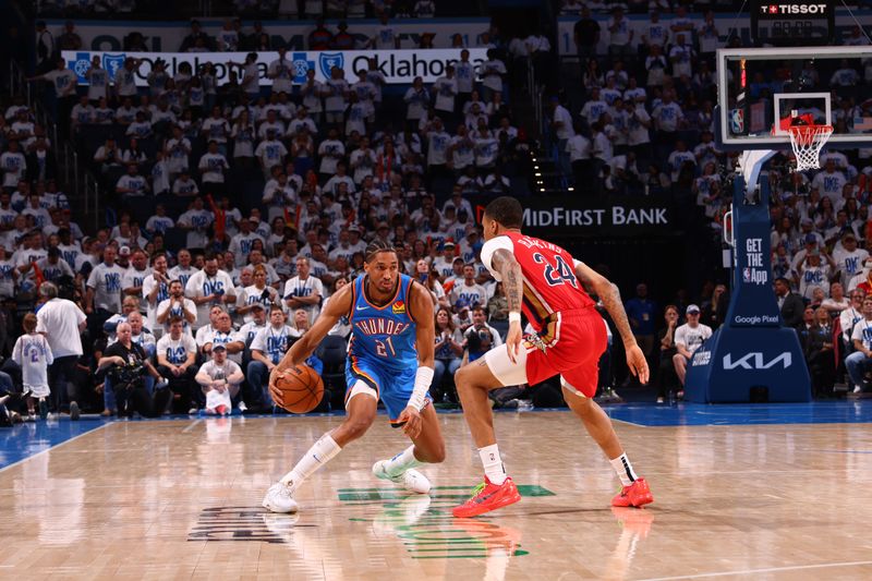 OKLAHOMA CITY, OK - APRIL 24: Aaron Wiggins #21 of the Oklahoma City Thunder dribbles the ball during the game against the New Orleans Pelicans during Round 1 Game 2 of the 2024 NBA Playoffs on April 24, 2024 at Paycom Arena in Oklahoma City, Oklahoma. NOTE TO USER: User expressly acknowledges and agrees that, by downloading and or using this photograph, User is consenting to the terms and conditions of the Getty Images License Agreement. Mandatory Copyright Notice: Copyright 2024 NBAE (Photo by Zach Beeker/NBAE via Getty Images)