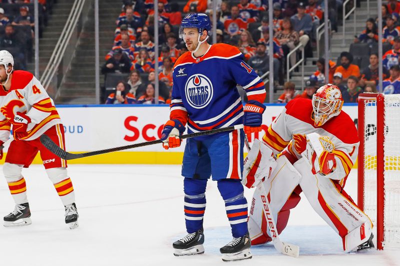 Sep 23, 2024; Edmonton, Alberta, CAN; Edmonton Oilers forward Zach Hyman (18) tries to screen Calgary Flames goaltender Devin Cooley (1) during the third period at Rogers Place. Mandatory Credit: Perry Nelson-Imagn Images