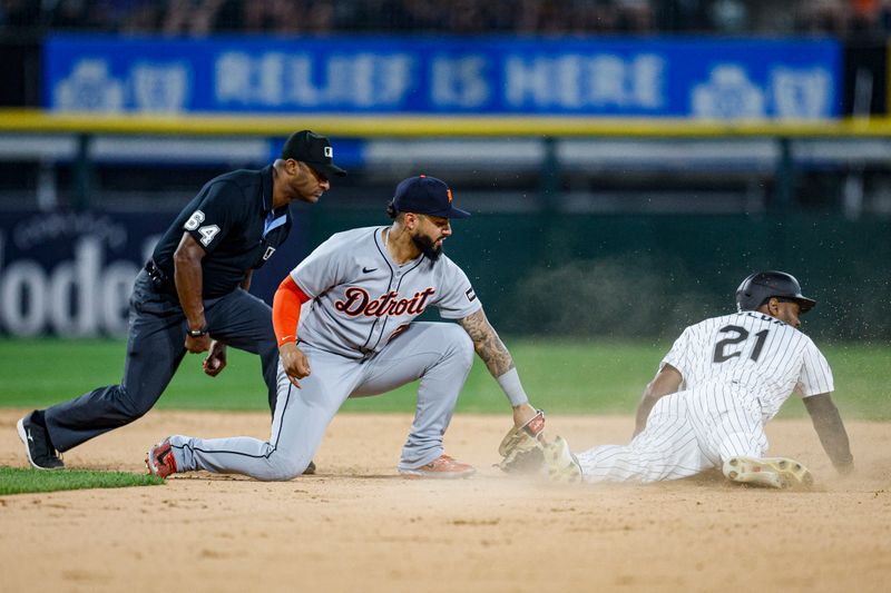 Jun 3, 2025; Chicago, Illinois, USA; Chicago White Sox center fielder Michael A. Taylor (21) steals second base against Detroit Tigers second baseman Gleyber Torres (25) during the eight inning at Rate Field. Mandatory Credit: Kamil Krzaczynski-Imagn Images