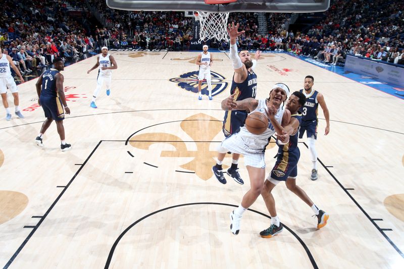 NEW ORLEANS, LA - APRIL 3:  Paolo Banchero #5 of the Orlando Magic looses control of the ball during the game against the New Orleans Pelicans on April 3, 2024 at the Smoothie King Center in New Orleans, Louisiana. NOTE TO USER: User expressly acknowledges and agrees that, by downloading and or using this Photograph, user is consenting to the terms and conditions of the Getty Images License Agreement. Mandatory Copyright Notice: Copyright 2024 NBAE (Photo by Layne Murdoch Jr./NBAE via Getty Images)