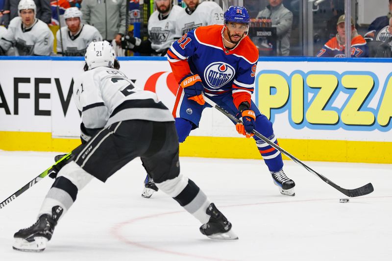 May 1, 2024; Edmonton, Alberta, CAN; e/ forward Evander Kane (91) looks to make a pass in front of Los Angeles Kings defensemen Jordan Spence (21) during the third period in game five of the first round of the 2024 Stanley Cup Playoffs at Rogers Place. Mandatory Credit: Perry Nelson-USA TODAY Sports