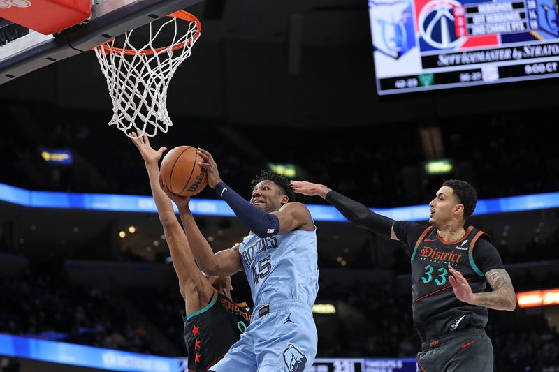 MEMPHIS, TENNESSEE - MARCH 12: GG Jackson #45 of the Memphis Grizzlies during the game against Kyle Kuzma #33 of the Washington Wizards during the second half at FedExForum on March 12, 2024 in Memphis, Tennessee. NOTE TO USER: User expressly acknowledges and agrees that, by downloading and or using this photograph, User is consenting to the terms and conditions of the Getty Images License Agreement. (Photo by Justin Ford/Getty Images)