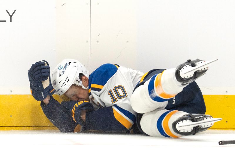 Oct 10, 2024; San Jose, California, USA;  St. Louis Blues center Brayden Schenn (10) lays on the ice after getting hit in the face during the third period against the San Jose Sharks at SAP Center at San Jose. Mandatory Credit: Stan Szeto-Imagn Images