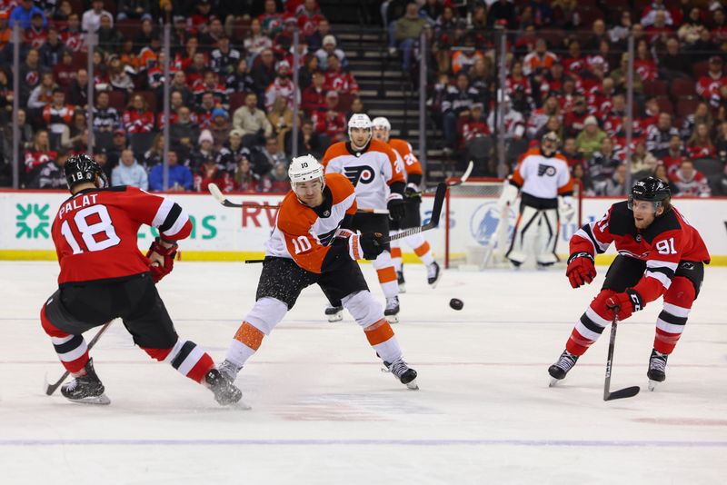 Dec 19, 2023; Newark, New Jersey, USA; Philadelphia Flyers right wing Bobby Brink (10) shoots the puck while being defended by New Jersey Devils left wing Ondrej Palat (18) during the first period at Prudential Center. Mandatory Credit: Ed Mulholland-USA TODAY Sports