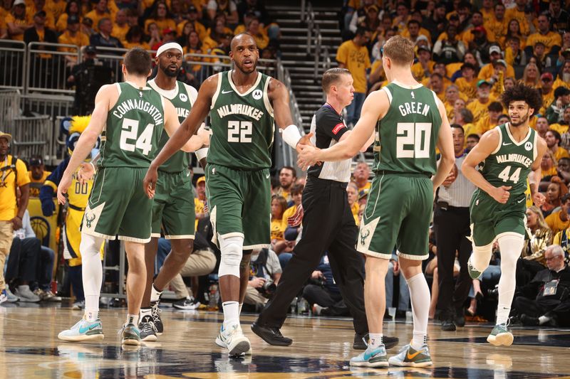 INDIANAPOLIS, IN - APRIL 26: Khris Middleton #22 and AJ Green #20 of the Milwaukee Bucks high five during the game against the Indiana Pacers during Round 1 Game 3 of the 2024 NBA Playoffs on April 26, 2024 at Gainbridge Fieldhouse in Indianapolis, Indiana. NOTE TO USER: User expressly acknowledges and agrees that, by downloading and or using this Photograph, user is consenting to the terms and conditions of the Getty Images License Agreement. Mandatory Copyright Notice: Copyright 2023 NBAE (Photo by Nathaniel S. Butler/NBAE via Getty Images)