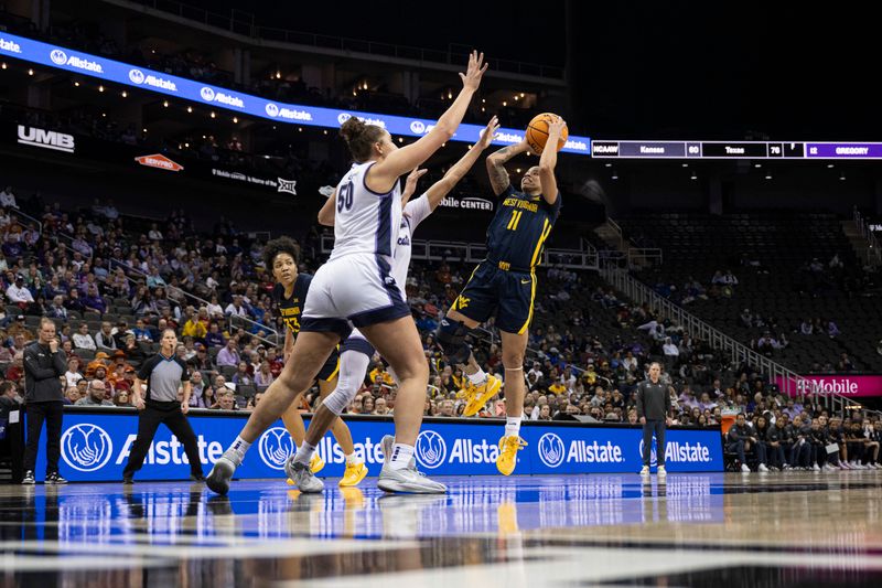 Mar 9, 2024; Kansas City, MO, USA; West Virginia Mountaineers guard JJ Quinerly (11) shoots the ball against Kansas State Wildcats center Ayoka Lee (50) during the first half at T-Mobile Center. Mandatory Credit: Amy Kontras-USA TODAY Sports