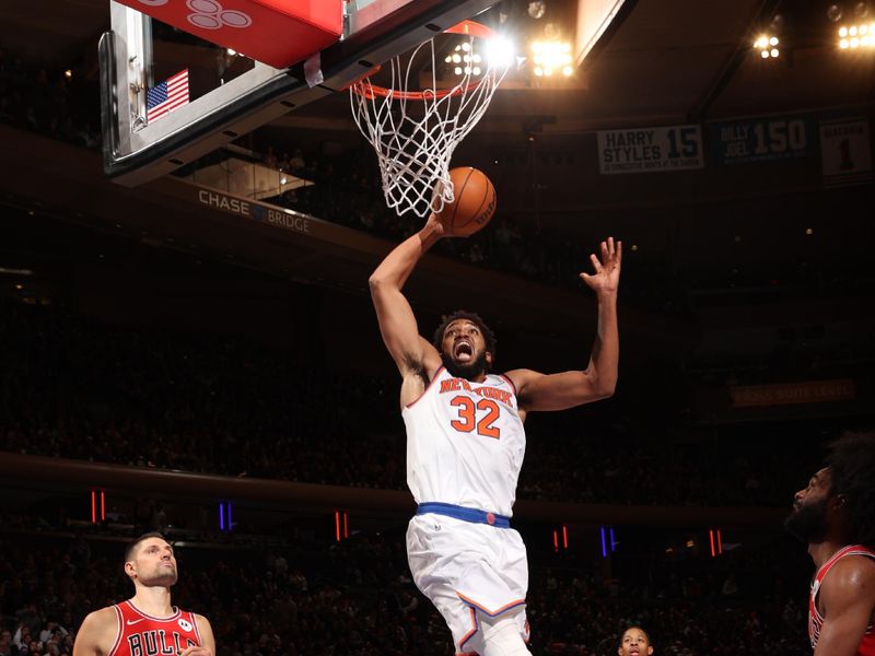 NEW YORK, NY - NOVEMBER 13: Karl-Anthony Towns #32 of the New York Knicks dunks the ball during the game against the Chicago Bulls on November 13, 2024 at Madison Square Garden in New York City, New York.  NOTE TO USER: User expressly acknowledges and agrees that, by downloading and or using this photograph, User is consenting to the terms and conditions of the Getty Images License Agreement. Mandatory Copyright Notice: Copyright 2024 NBAE  (Photo by Joe Murphy/NBAE via Getty Images)