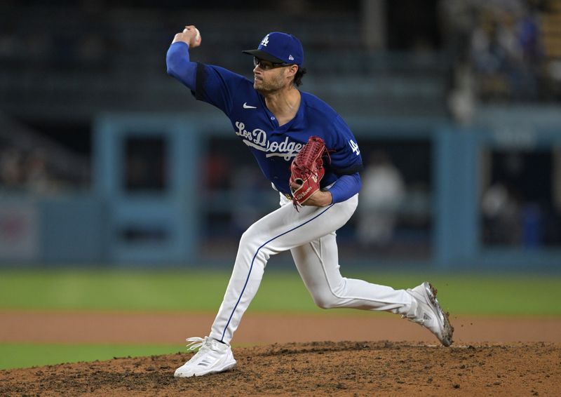 Sep 18, 2023; Los Angeles, California, USA;  Los Angeles Dodgers relief pitcher Joe Kelly (17) delivers a scoreless ninth inning against the Detroit Tigers at Dodger Stadium. Mandatory Credit: Jayne Kamin-Oncea-USA TODAY Sports