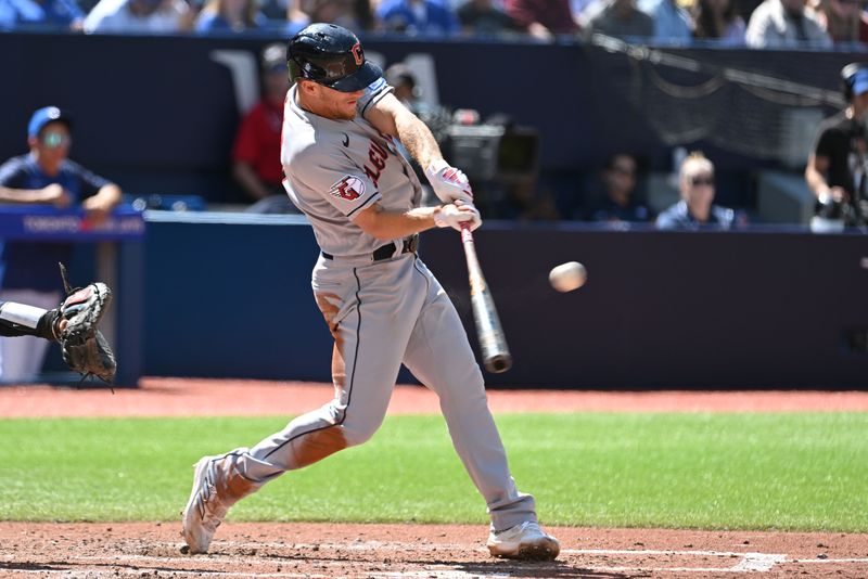 Aug 27, 2023; Toronto, Ontario, CAN;  Cleveland Guardians center fielder Myles Straw (7) hits an RBI single against the Toronto Blue Jays in the fourth inning at Rogers Centre. Mandatory Credit: Dan Hamilton-USA TODAY Sports