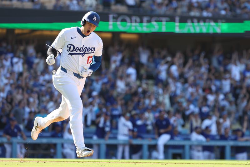 Sep 22, 2024; Los Angeles, California, USA;  Los Angeles Dodgers designated hitter Shohei Ohtani (17) celebrates on a game tying solo home run during the ninth inning against the Colorado Rockies at Dodger Stadium. Mandatory Credit: Kiyoshi Mio-Imagn Images