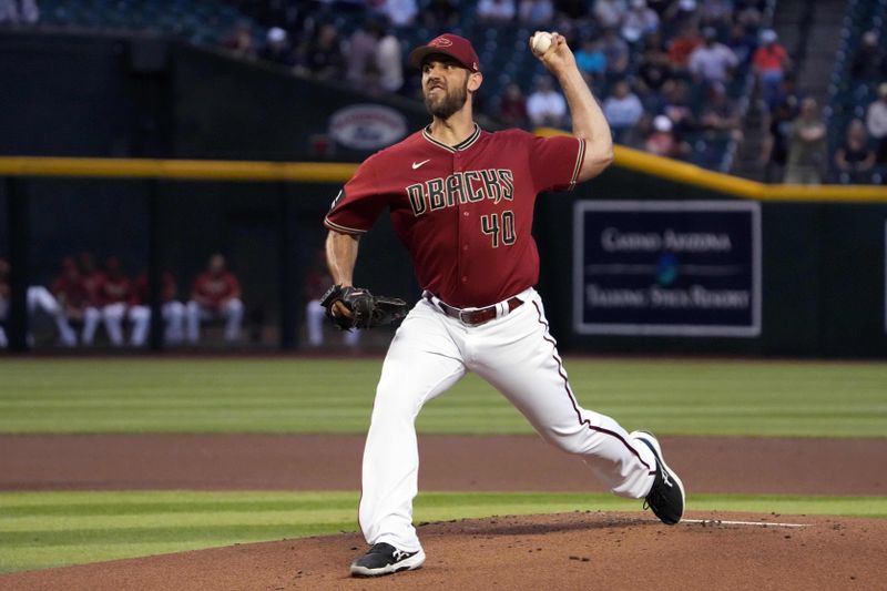 Mar 27, 2023; Phoenix, Arizona, USA; Arizona Diamondbacks starting pitcher Madison Bumgarner (40) pitches against the Cleveland Guardians during the first inning at Chase Field. Mandatory Credit: Joe Camporeale-USA TODAY Sports